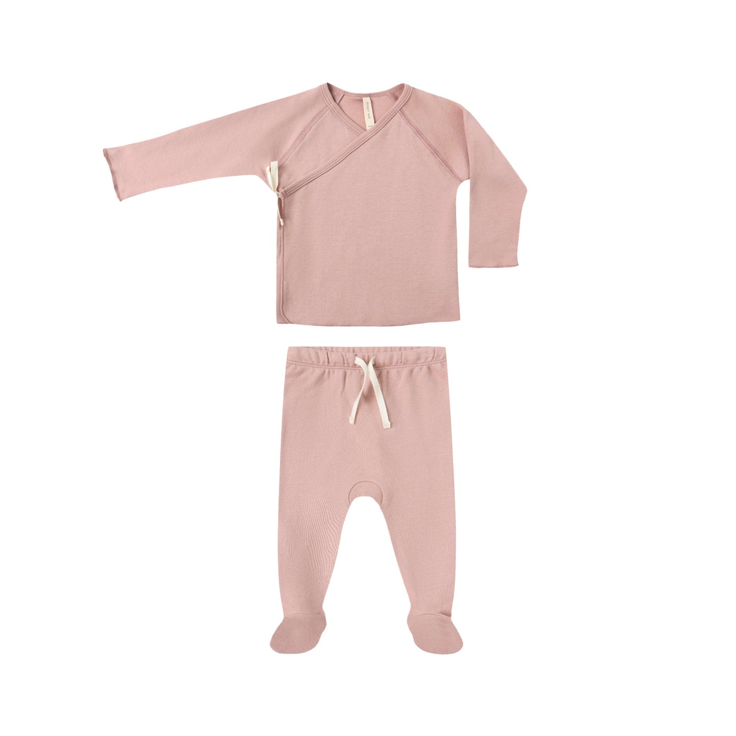 Pink baby outfit with long-sleeve top and footed pants on a white background