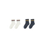 Two pairs of socks, one white and one navy, with striped cuffs on a white background.